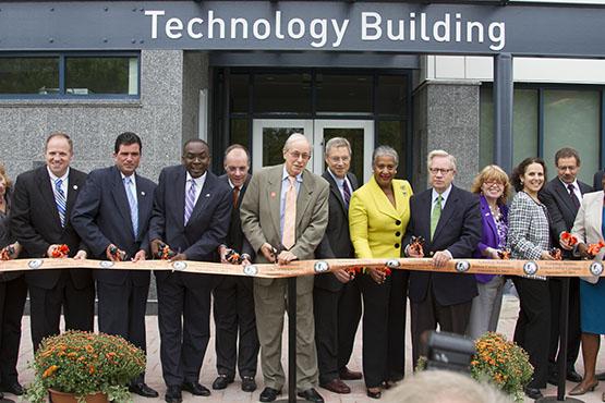 Mayor Byron Brown, second from left, joined interim President Howard Cohen and dozens of other faculty and students on Thursday to mark the official opening of the new Technology Building, which began hosting classes this semester.