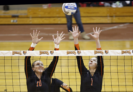 Kelsey Bashore (left) had 44 assists and Kayla Pyc (right) had 11 kills for Buffalo State in its SUNYAC title win over New Paltz on Sunday.