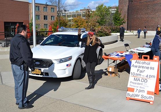 University Police Officer Scott Richards walks student through a mock sobriety test.