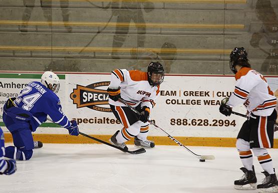 Taylor McGraw carries the puck in the zone during Buffalo States 4-4 tie against Fredonia Friday.