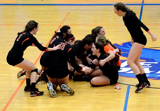 Buffalo State volleyball celebrates after defeating top seed and host New Paltz in the SUNYAC championship game Saturday to earn the programs first NCAA tournament berth in school history.