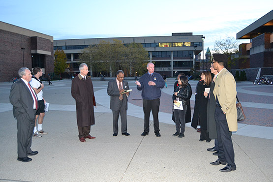 Provost Dennis Ponton, Vice President Hal Payne, and USG President Eric Sauerzopf join President Howard Cohen and other campus members on a walk through the campus to talk about lighting, and safety.