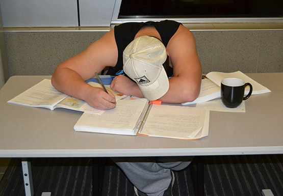 John Nickerson, a sophomore sociology major, demonstrates what not to do during finals week. Procrastinate less, plan more and tackle small tasks to achieve the highest grade possible.