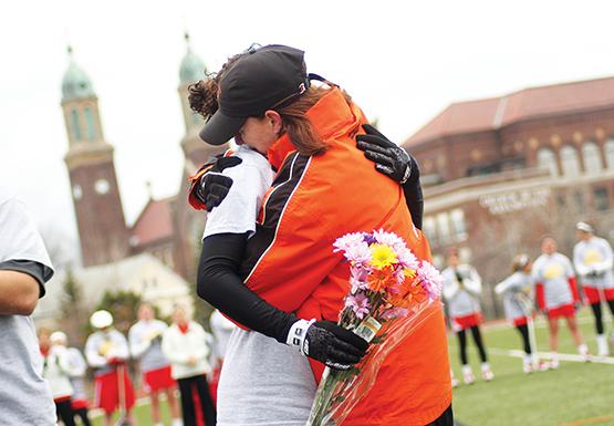 Ashley Caporizzo embraces coach Meg Stevens before the Bengals’ senior game against Cortland Saturday. The game also served as a remembrance of Molly Seifritz, who passed away from Ewing’s sarcoma in March.