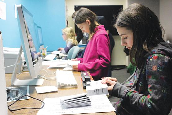 From front: Maria Ziaja, 13; Niamin Schroeder, 9; and other girls participate in the Tech Arts for Girls workshop at Squeaky Wheel.