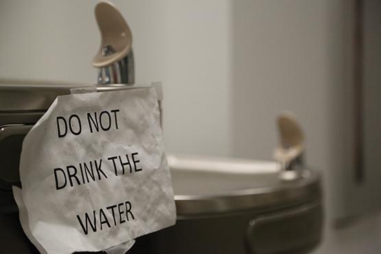 Signs are posted on all available water fountains and sinks warning people of unsafe water.