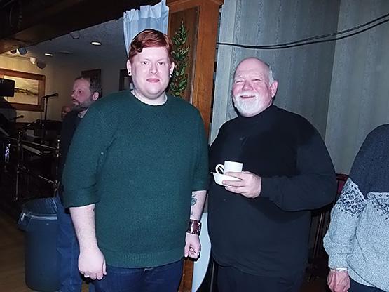 Senior history major Daniel Flynn, left, with Fr. Czeslaw Krysa