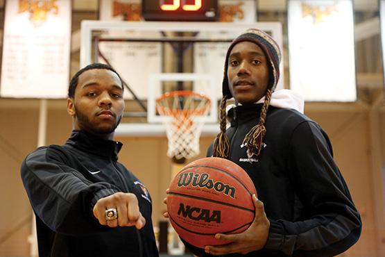 Rey Jordan shows off his Class A New York State championship ring next to high school and Buffalo State teammate Lovell Smith (right, in hat). The pair made history at nearby McKinley High School almost exactly a year ago, helping the school to its first-ever state championship.  