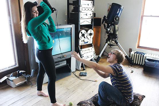 Zoe Thayer, left, shows her boyfriend Dylan Maychoss, right, what the consequences if spending more time with his playstation than her might be. Some women agree that gaming has taken up far too much of their significant others time.