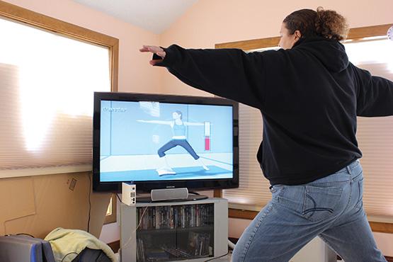 Student Lori Stellrecht uses Wii Fit's yoga program for more than just entertainment.