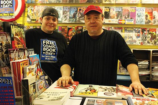Queen City Bookstore owners Emil Novak, Jr. and Emil Novak, Sr. behind the counter.