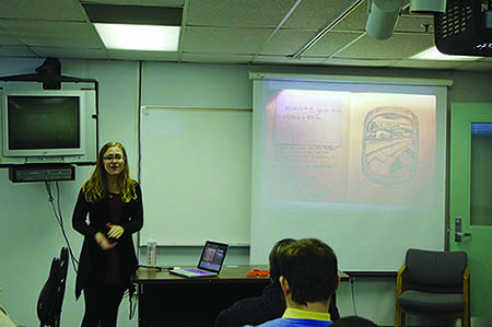 Molly Bader shows pictures from her art journal during her presentation last Tuesday