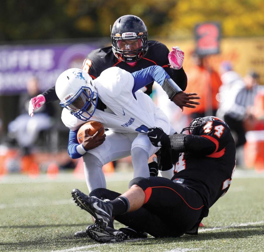 Senior linebacker John Alessandra (44), sophomore linebacker Demetrius Brown (16) and the Buffalo State defense held Finlandia to a program-record 24 yards of total offense in a 62-0 rout on Saturday. 