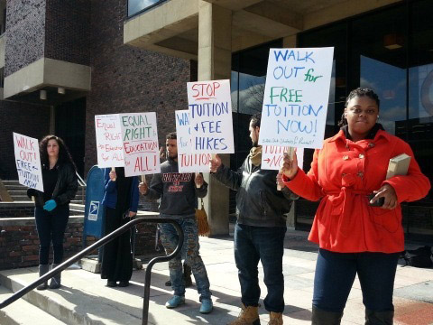 The Buffalo State Students for Revolution (pictured above) participate
in the SUNY-wide walkout on the steps in front of the Student Union