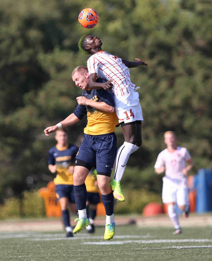 Sophomore forward Bass Sarr leaps for a header in a recent victory over Medaille College.
