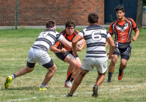 Senior Justin brzyski (iddle) and the mens club rugby team beat rival Niagara, 45-29, in their season-opener