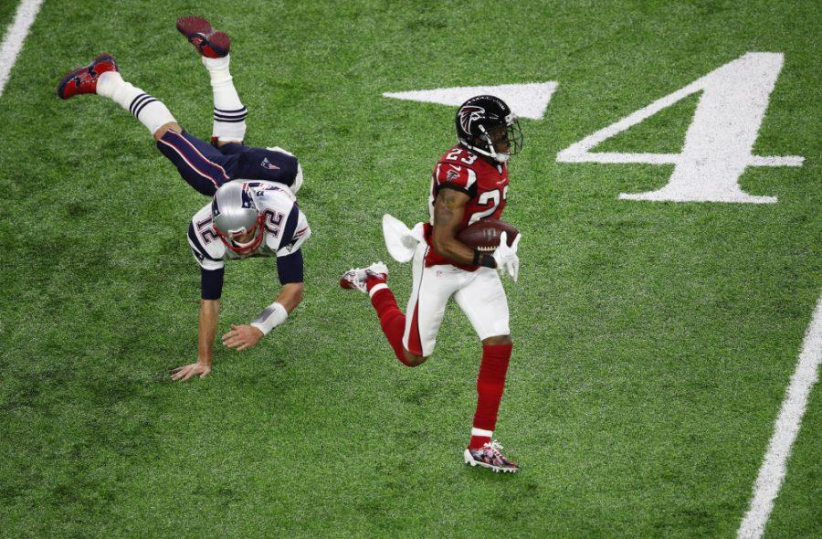 HOUSTON, TX - FEBRUARY 05:  Tom Brady #12 of the New England Patriots attempts to tackle Patrick Chung #23 of the New England Patriots after an interception in the second quarter during Super Bowl 51 at NRG Stadium on February 5, 2017 in Houston, Texas.  (Photo by Ezra Shaw/Getty Images) ORG XMIT: 694911629 ORIG FILE ID: 633949064