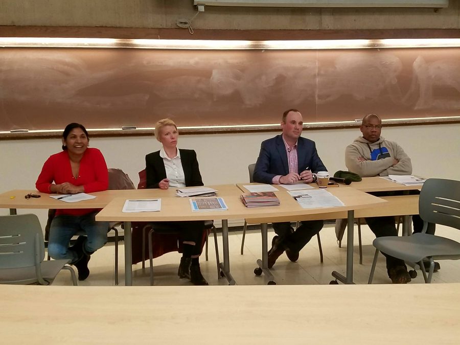 Dr. Suparna Soni, Sara Norrevik, Michael Schraft and Dr. Anthony Neal listen to student questions at Thursdays First 100 Days panel.