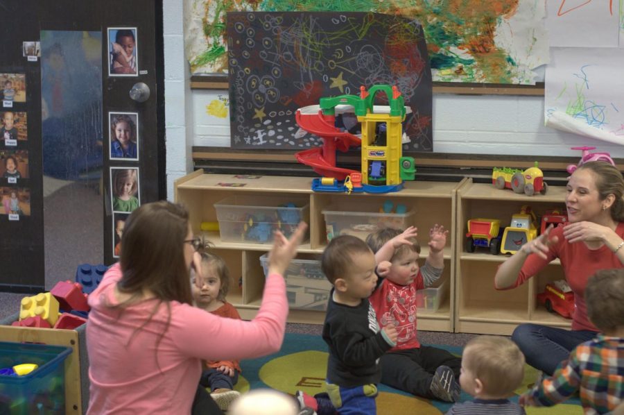 Volunteers from the Musical Education Department sing songs and share their skills with the children at the Buffalo State Childcare Center, in celebration of The Week of the Young Child.