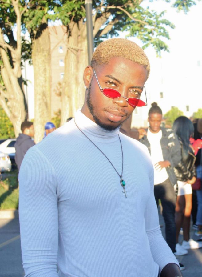 A Buffalo State student shows off his fierce blonde hair complimenting his trendy style.