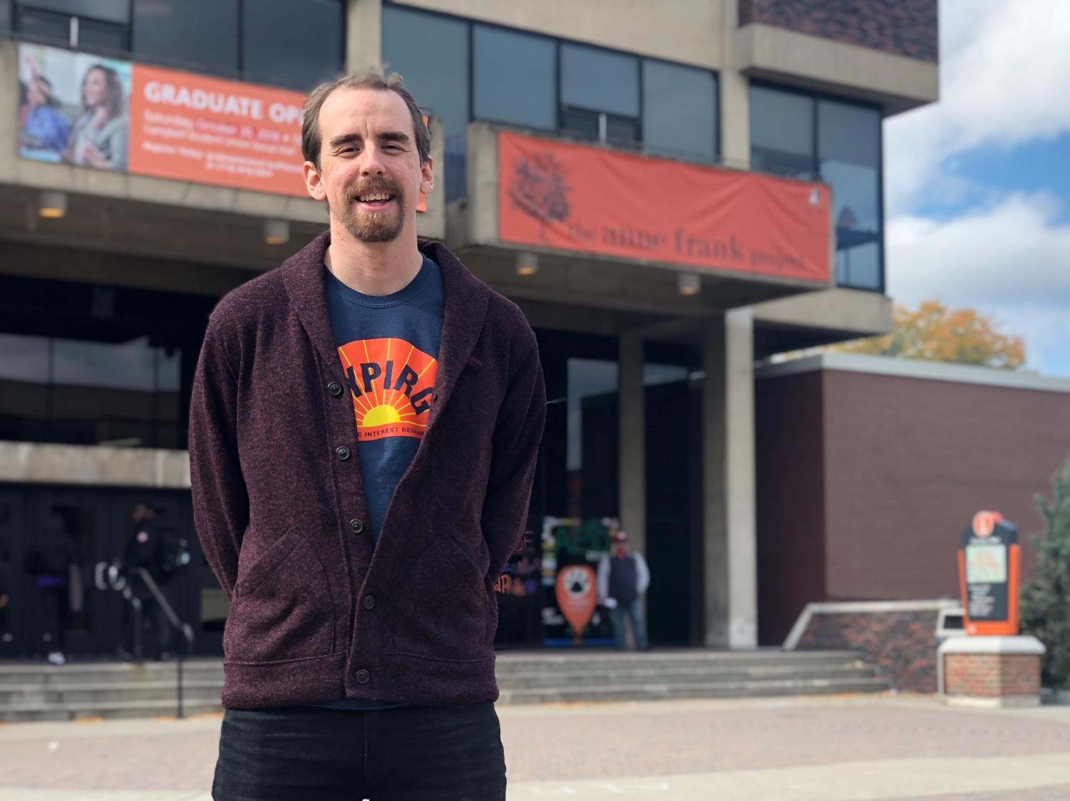 Scott Benedict stands in front of SUNY Buffalo State's Campbell Student Union, where he hopes students' new polling place will be November 2019.