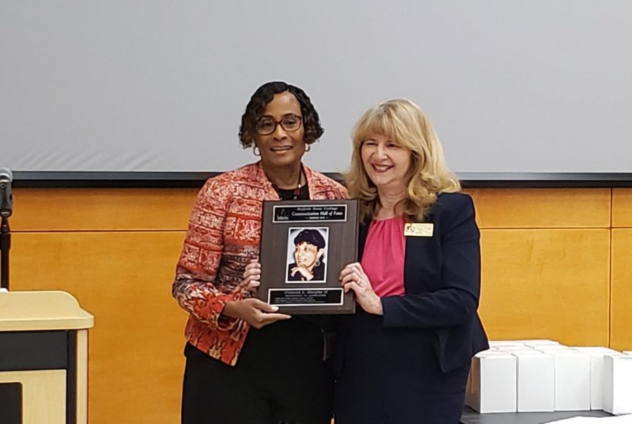 Dr. Toni Draper, daughter of Frances L. Murphy, accepts her mothers posthumous the induction into the Communcation Deaprtment Hall of Fame from chair Dr. Deborah A. Silverman. 