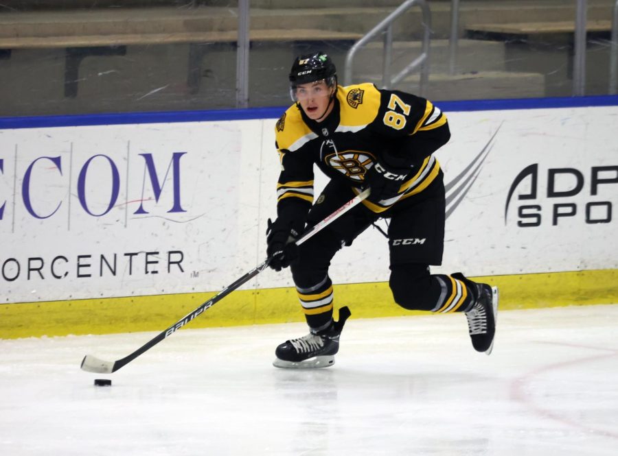 Bruins Prospect looks for a pass up ice during the second period