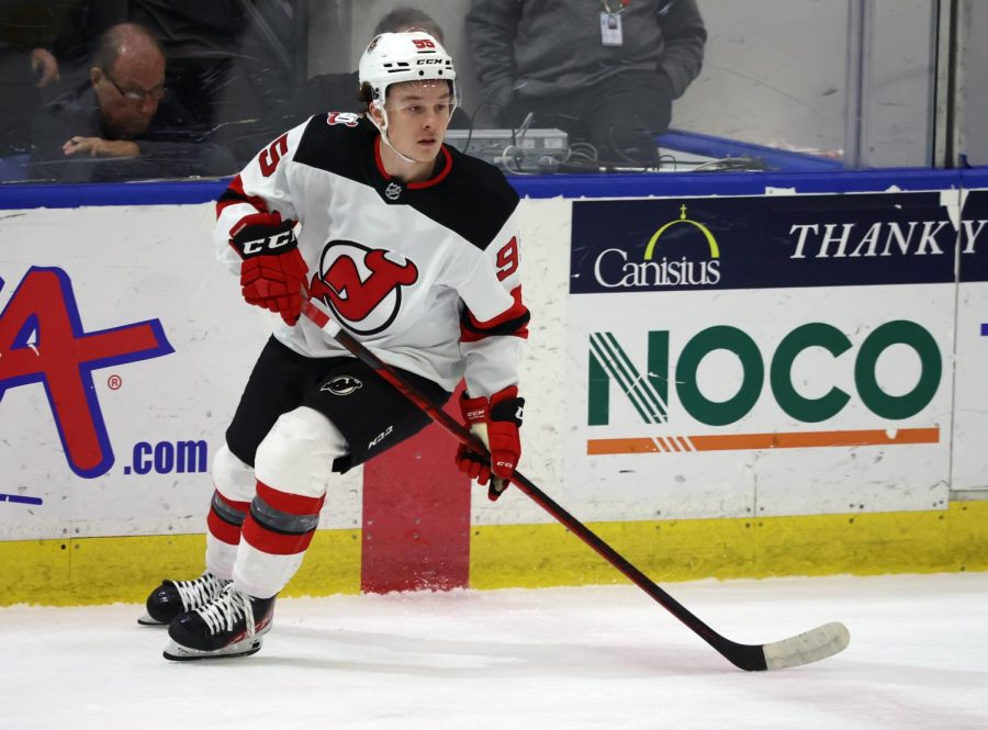 Devils Prospect Brody Crane looks for a pass from his teammate
