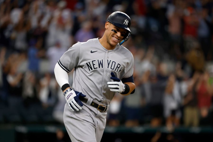 ARLINGTON, TX - OCTOBER 4: Aaron Judge #99 of the New York Yankees smiles as he rounds the bases after hitting his 62nd home run of the season against the Texas Rangers during the first inning in game two of a double header at Globe Life Field on October 4, 2022 in Arlington, Texas. Judge has now set the American League record for home runs in a single season. (Photo by Ron Jenkins/Getty Images)