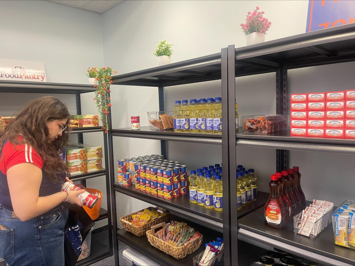 Student looking for food at Buffalo State's food pantry