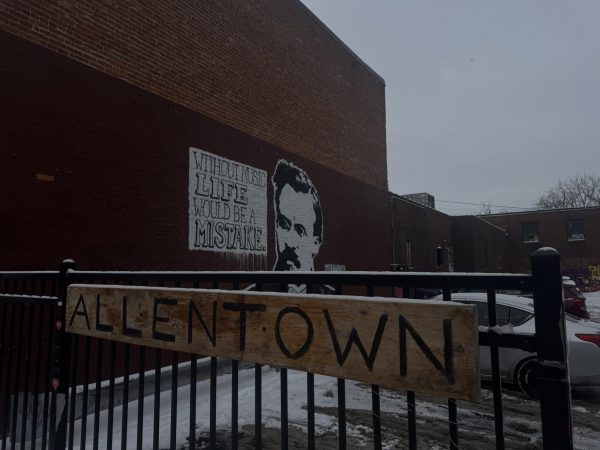 Mural and sign outside Nietzsche's on Allen St.