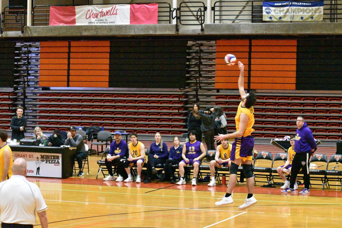 McLain (33) hitting a serve