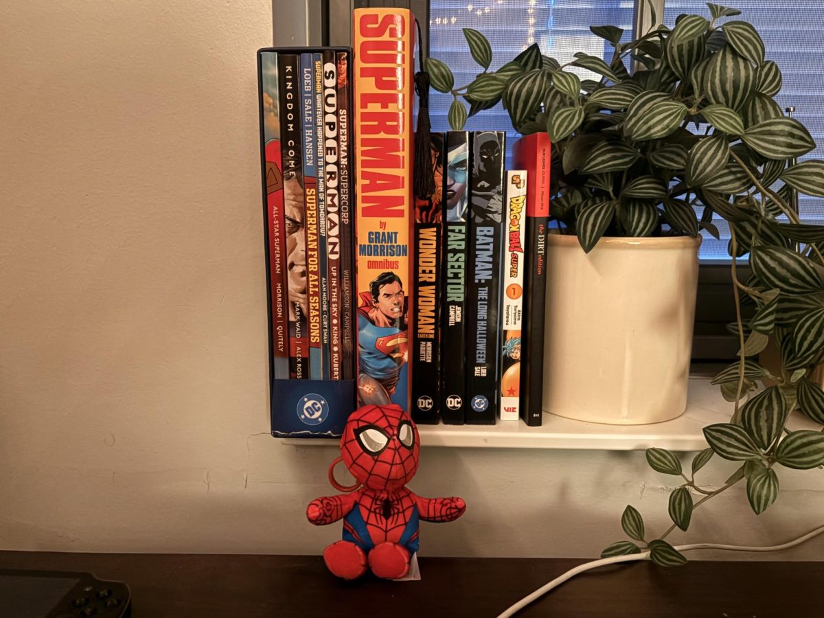 A shelf holding superhero comics (and some manga)