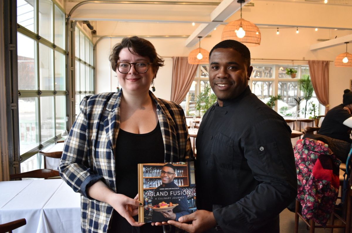 Executive Chef Chris Sinclair-McCalla, right, and Devin Hogan with Sinclair-McCalla's cookbook