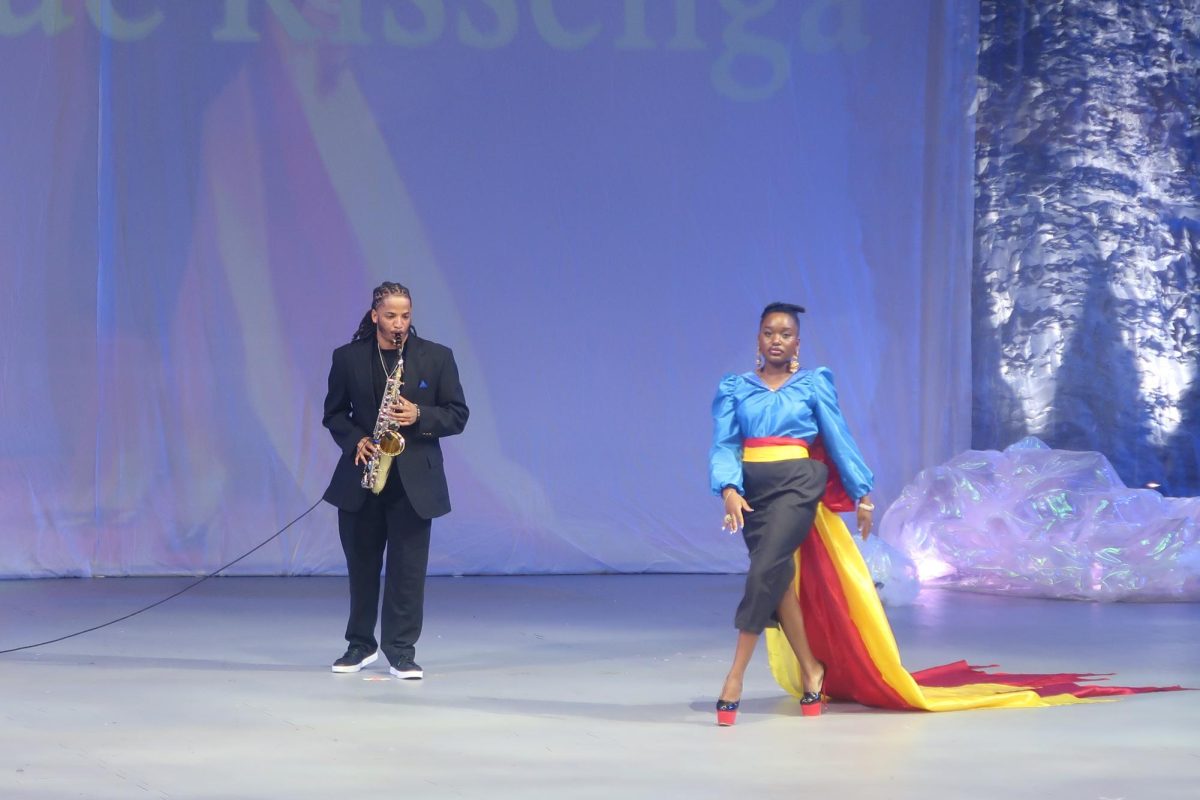 A model from Kissenga's collection walks onstage to saxophone music.  